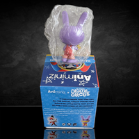 Purple-bunny figure from Digital Circus Amiminiz series in plastic wrap standing on its blue collectible box with star designs.