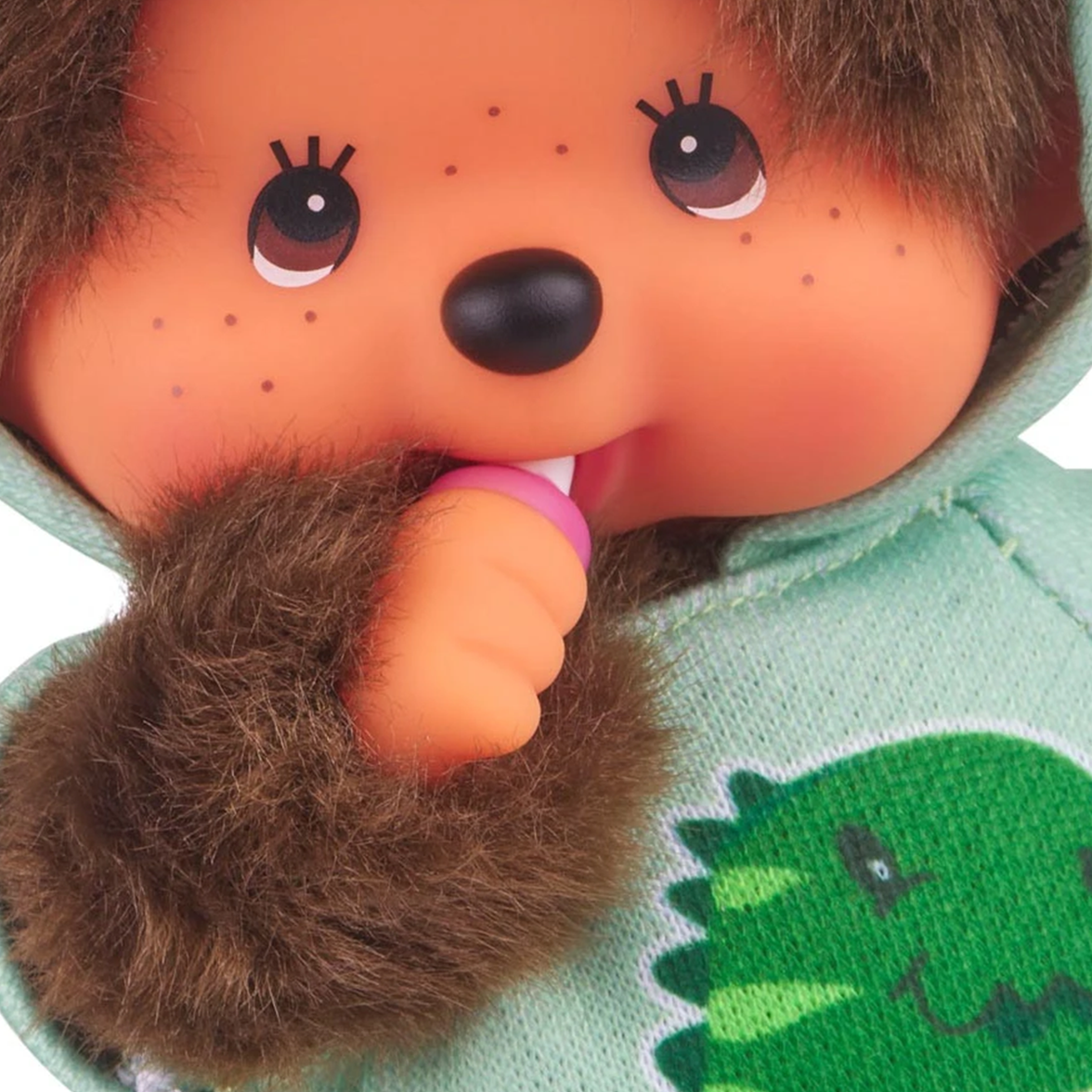 8" Monchhichi Dinosaur Hoodie Sekiguchi Plush Doll Boy With Brown Eyes close up in green dinosaur hoodie