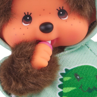 8" Monchhichi Dinosaur Hoodie Sekiguchi Plush Doll Boy With Brown Eyes close up in green dinosaur hoodie