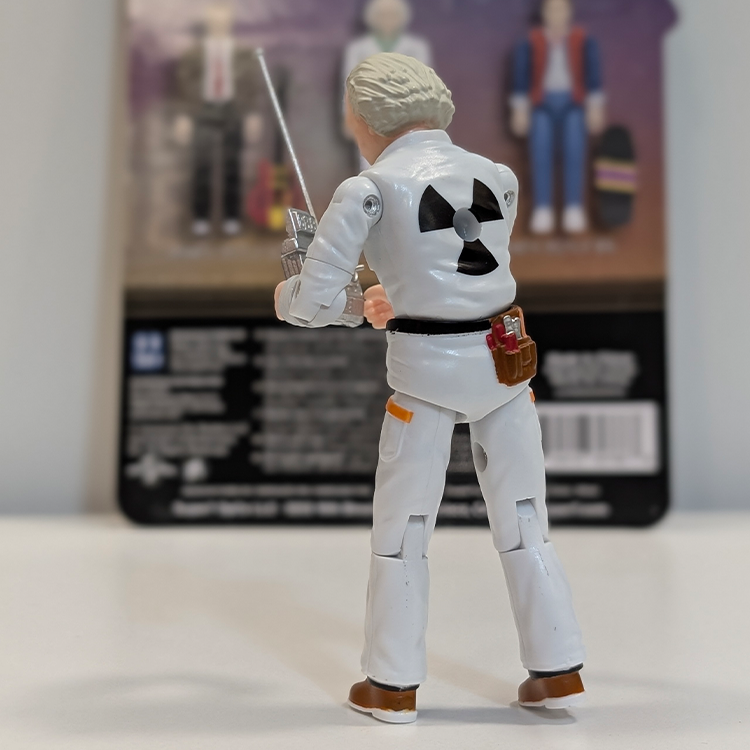 Super7 Back To The Future 3 3/4-inch Doc Brown figure in detailed white jumpsuit holding remote device facing packaging