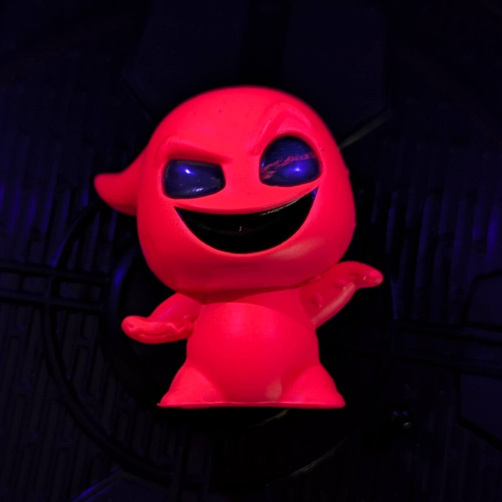 Go Figment black light mini-figure of mischievous glowing red character from Disney Doorables U-Pick series under dark lighting