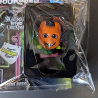 Go Figment Disney Doorables mini-figure with orange devil mask and wide grin from The Nightmare Before Christmas series in sealed blister pack