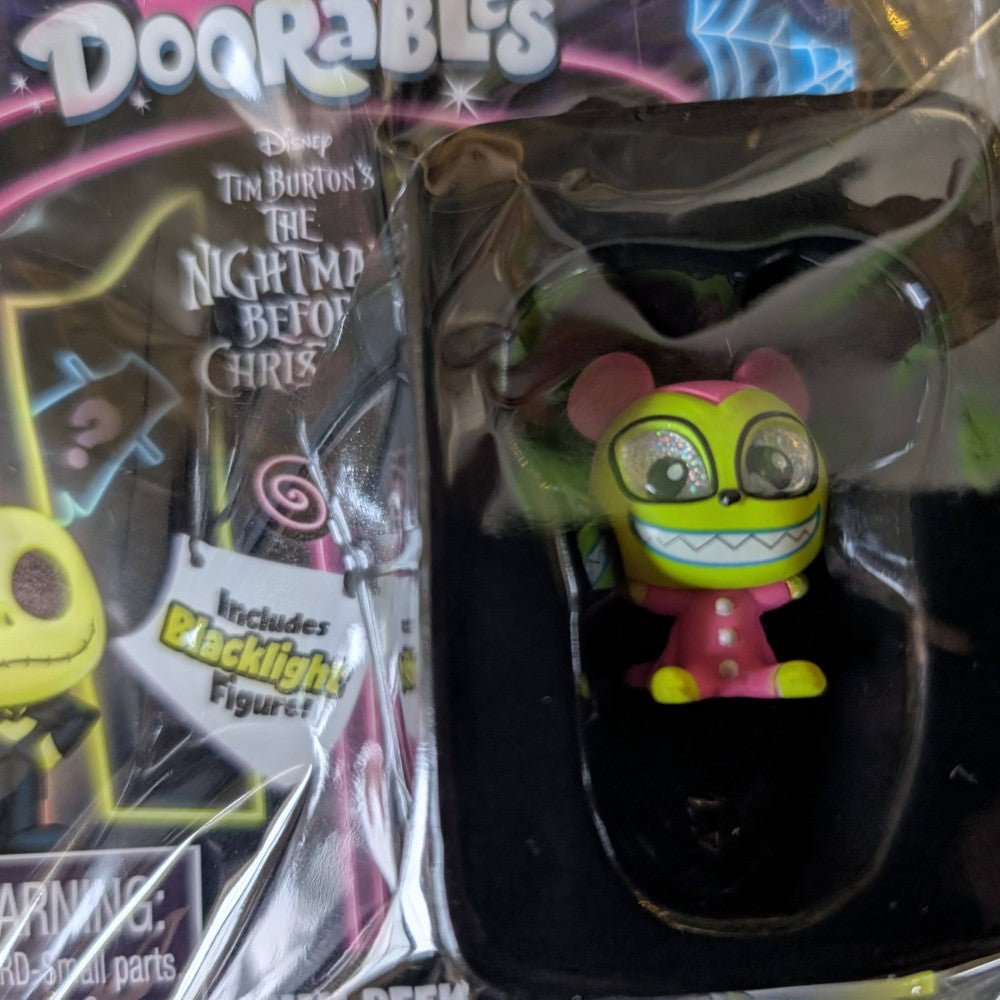 Go Figment Disney Doorables black light figure with bright green glowing face and large eyes from The Nightmare Before Christmas series