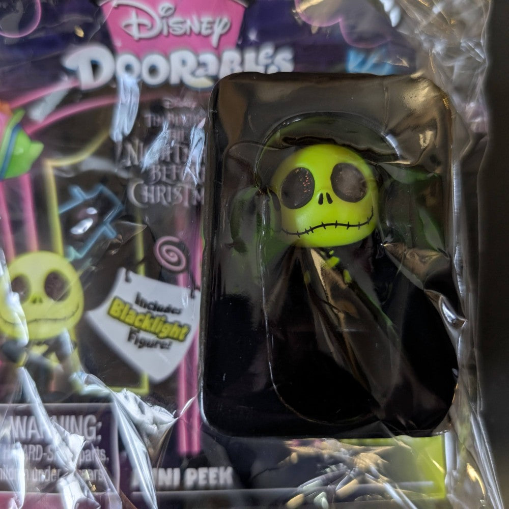 Go Figment Disney Doorables black light mini-figure featuring glowing green Jack Skellington from The Nightmare Before Christmas series