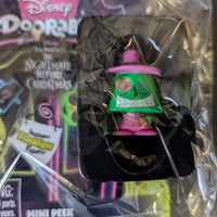 Go Figment Disney Doorables mini-figure with green glowing character wearing a pink hat from The Nightmare Before Christmas series