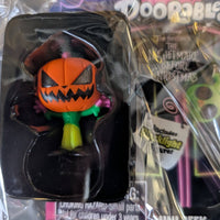 Go Figment Disney Doorables mini-figure featuring Halloween pumpkin character from Tim Burton's The Nightmare Before Christmas black light series
