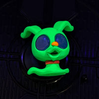 Go Figment black light Disney Doorables figure glowing green with large dark eyes and orange nose from U-Pick blind box series