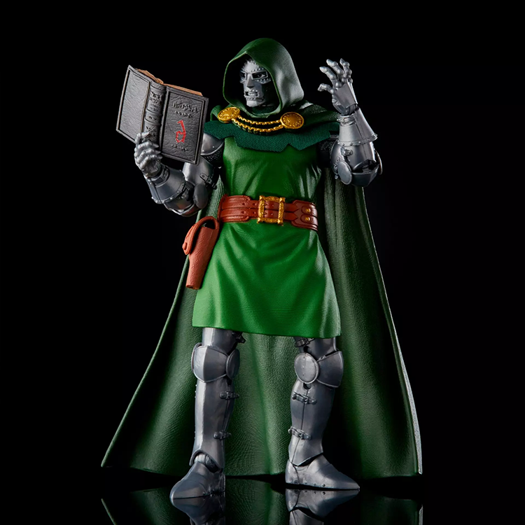Hasbro Marvel Legends Dr. Doom action figure in vintage style with green cape and open spellbook accessory