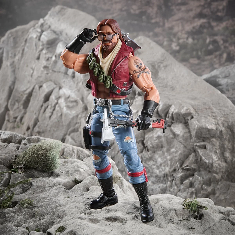 Dreadnok Monkeywrench 6-inch action figure by Hasbro in detailed outfit holding weapon on rocky terrain background