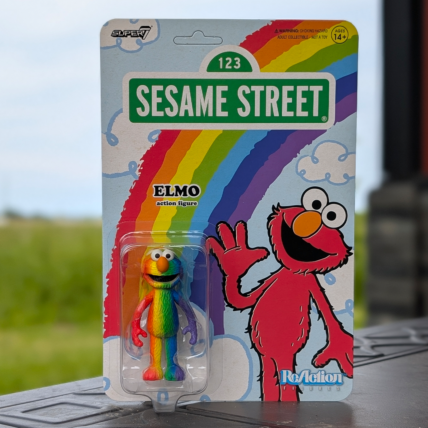 Elmo (Rainbow) – Sesame Street ReAction Exclusive U‑Pick Action Figure by Super7 new in box with rainbow design packaging
