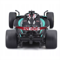 Bburago die-cast 1:43 scale Mercedes W15 George Russell 63 model car front view with detailed livery and helmet.