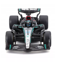 Bburago 1:43 scale die-cast Mercedes W15 Formula 1 car with George Russell figure and helmet details.