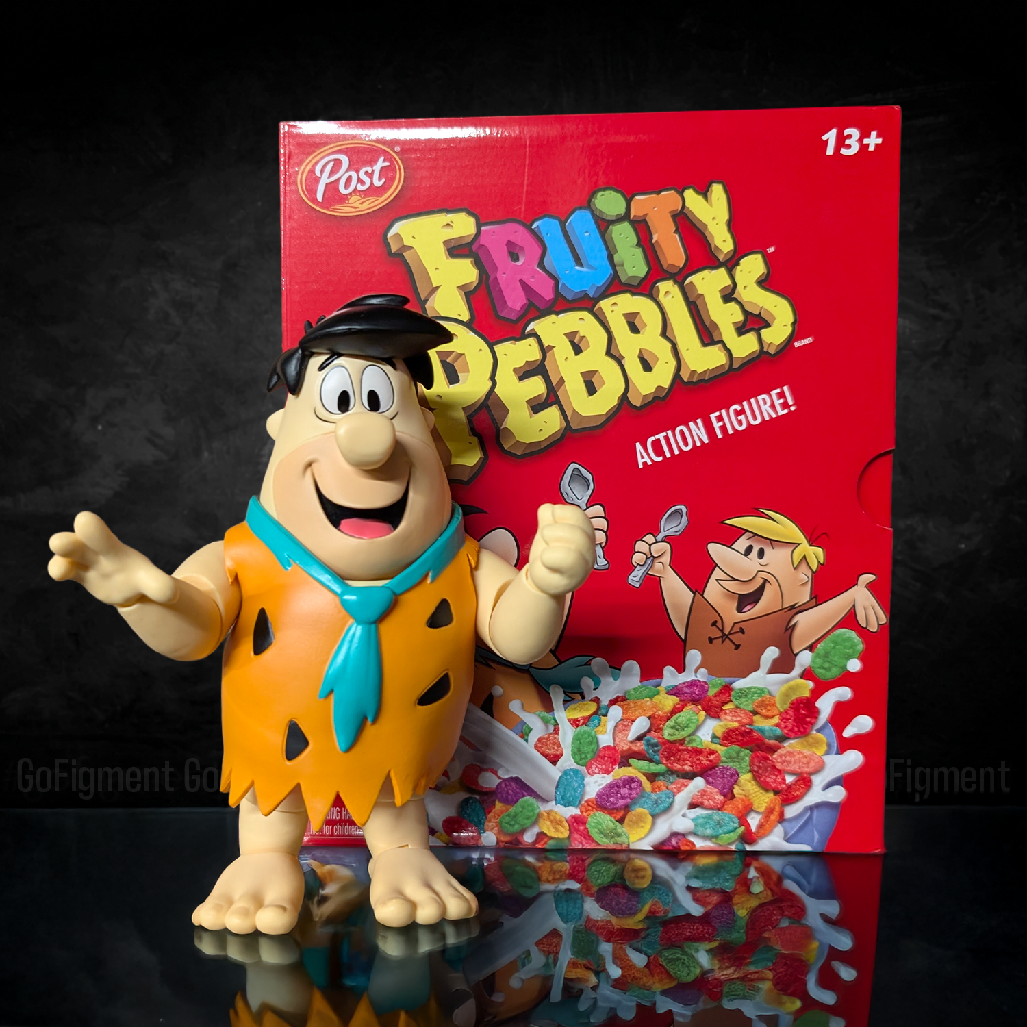 Fred Flintstone 1:12 Scale Action Figure - Premium Articulated Fruity Pebbles by Jada Toys with colorful cereal box backdrop.