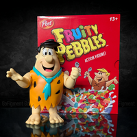 Fred Flintstone 1:12 Scale Action Figure - Premium Articulated Fruity Pebbles by Jada Toys with colorful cereal box backdrop.