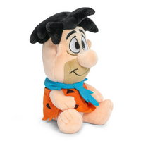 Fred Flintstone Phunny Plush: Hot-Headed, 7.5-Inch, Premium Quality Plush from Bedrock! by Kidrobot seated side view smiling