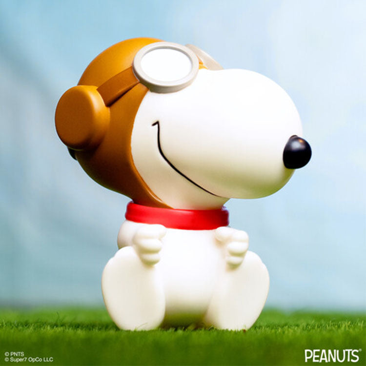 Funko Peanuts Flying Ace Snoopy 5 inch vinyl figure wearing pilot helmet and goggles sitting on grass