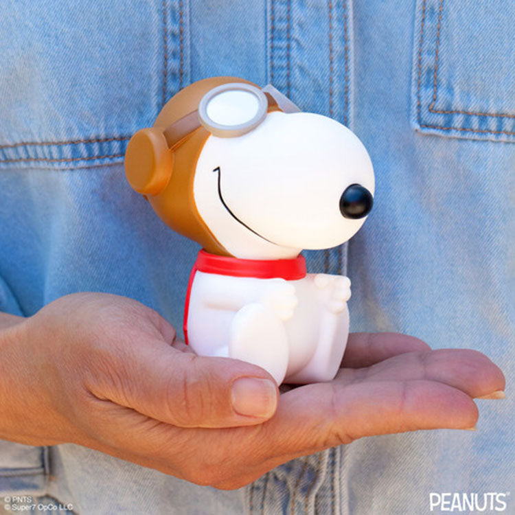 Funko Peanuts Flying Ace Snoopy vinyl figure 5 inch wearing pilot helmet and red scarf held in hand