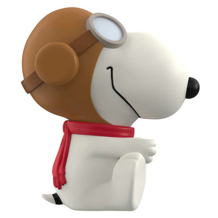 Funko Peanuts Flying Ace Snoopy vinyl figure wearing aviator helmet and red scarf sitting side view 5 inch