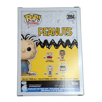 Funko Pop Peanuts Pigpen vinyl figure #2094 displayed in original box with character lineup on back panel