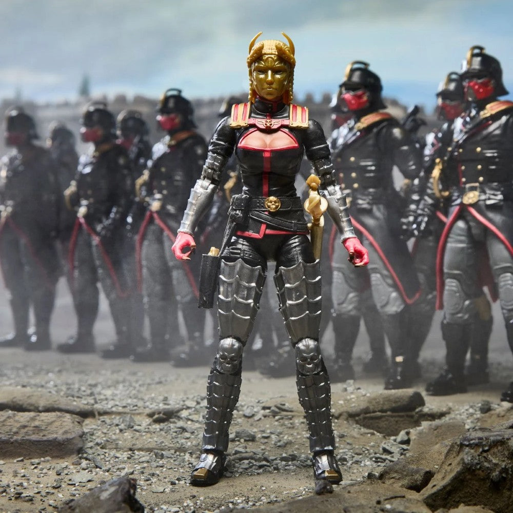 Female warrior action figure standing before a formation of armored figures on rocky terrain