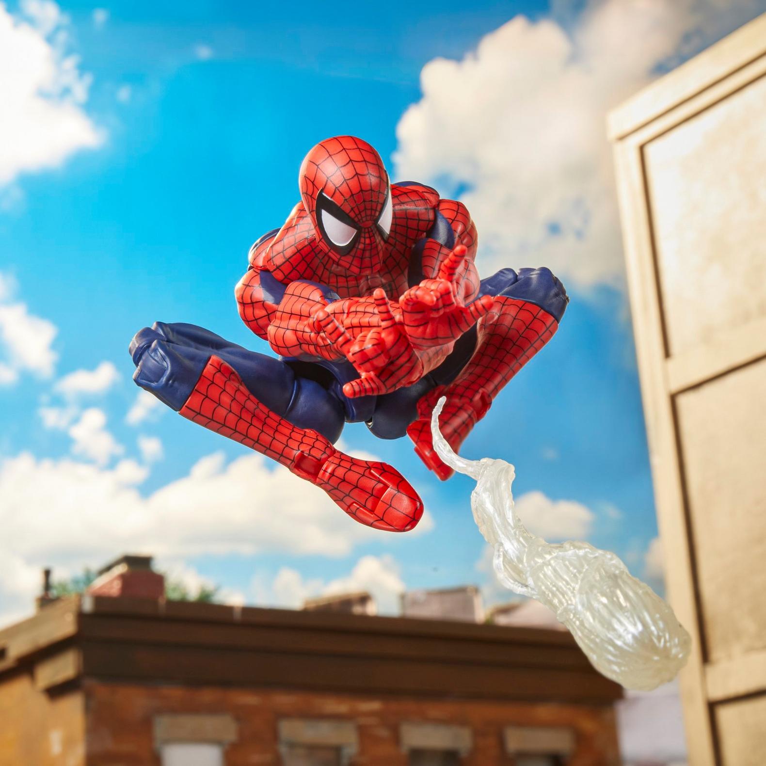 Hasbro 6 inch Spiderman action figure in mid-air pose shooting web with detailed costume and articulation