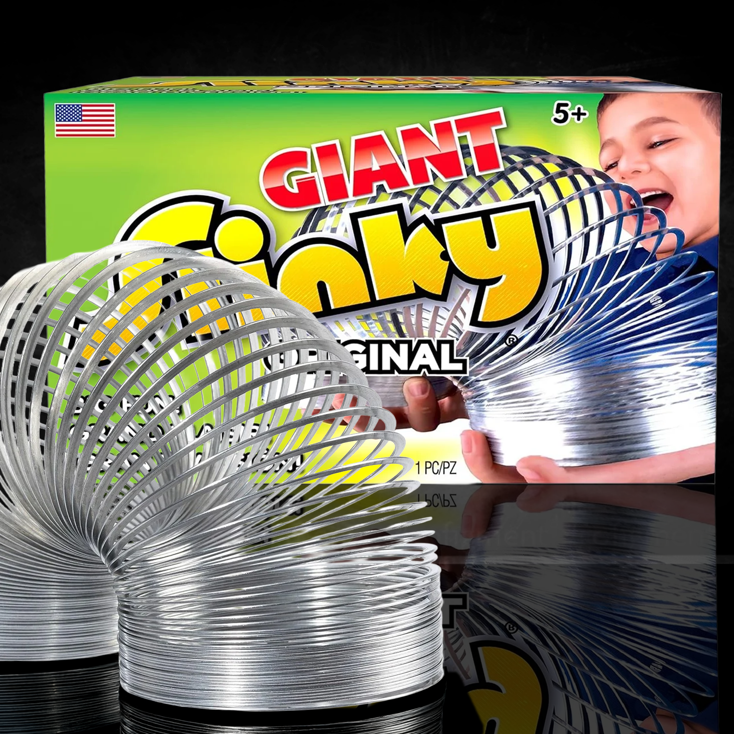 Giant Metal Slinky by Just Play showing a large metal coil toy in front of its colorful packaging with a child playing.