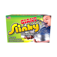 Child playing with a large silver metal coil toy held stretched between both hands on bright green background packaging.