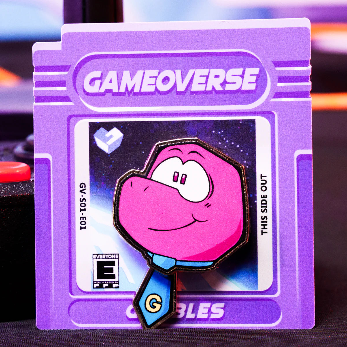 Gobbles Pin – Gameoverse Glitch Productions Enamel Collectible featuring pink character with blue tie on purple game cartridge card by Glitch new loose pin