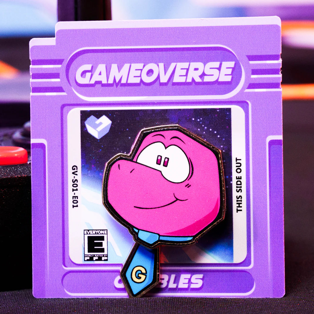 Gobbles Pin – Gameoverse Glitch Productions Enamel Collectible featuring pink character with blue tie on purple game cartridge card by Glitch new loose pin