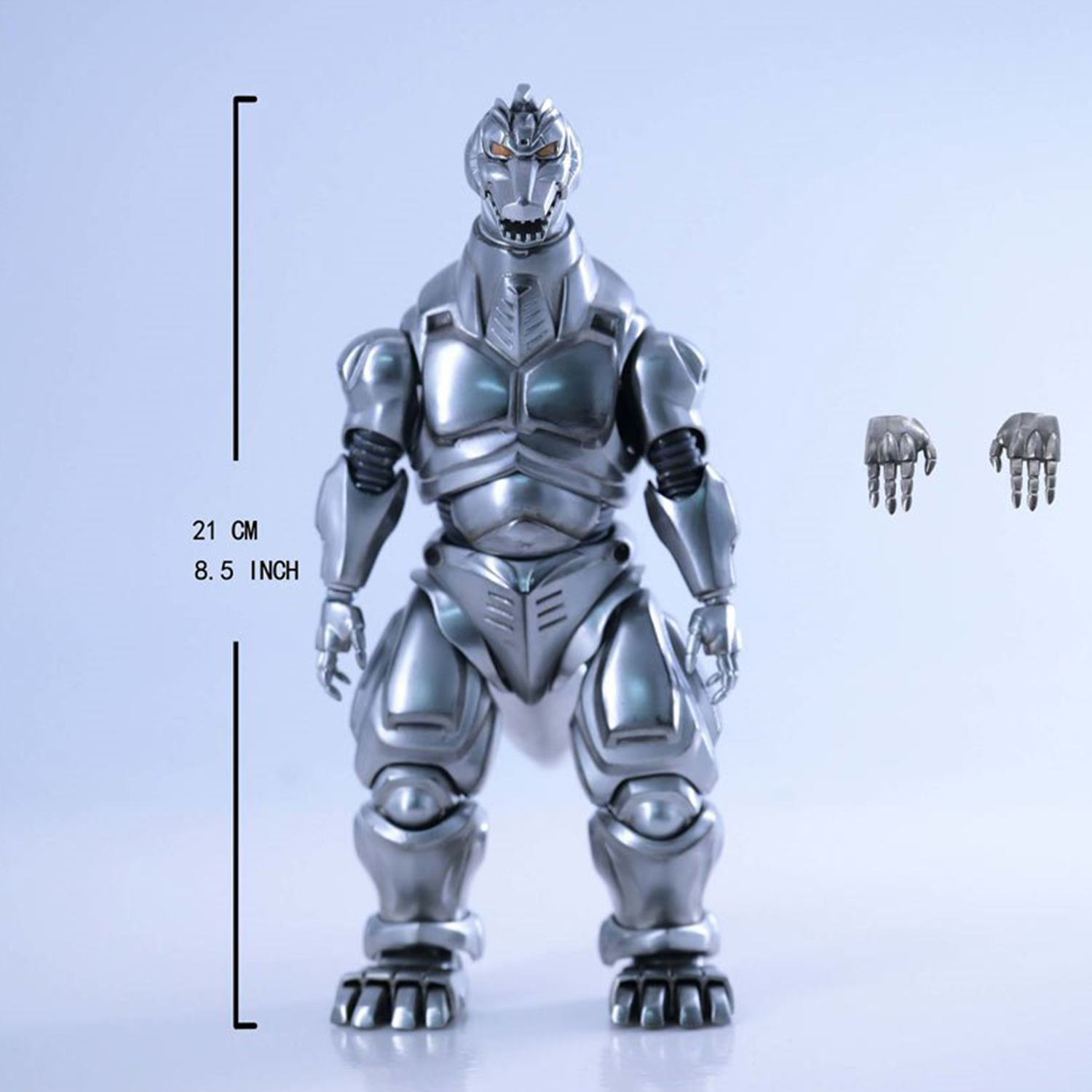 Silver metallic Mechagodzilla figure with segmented armor, standing upright with extra articulated hands beside it.