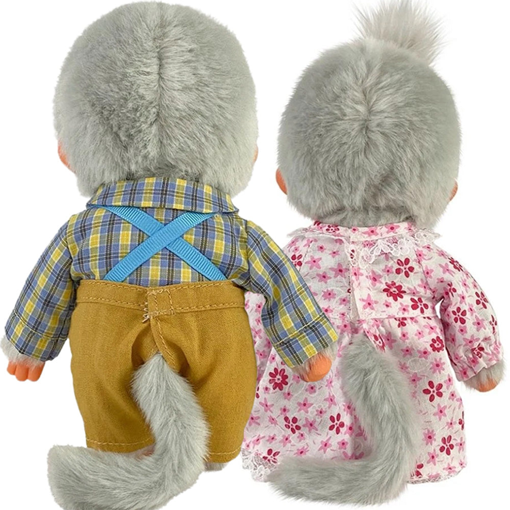 Two plush dolls dressed in vintage clothes with grey fur and bushy tails facing backward