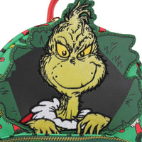 Loungefly How the Grinch Stole Christmas Grinch mini-backpack featuring Grinch face in Christmas present design