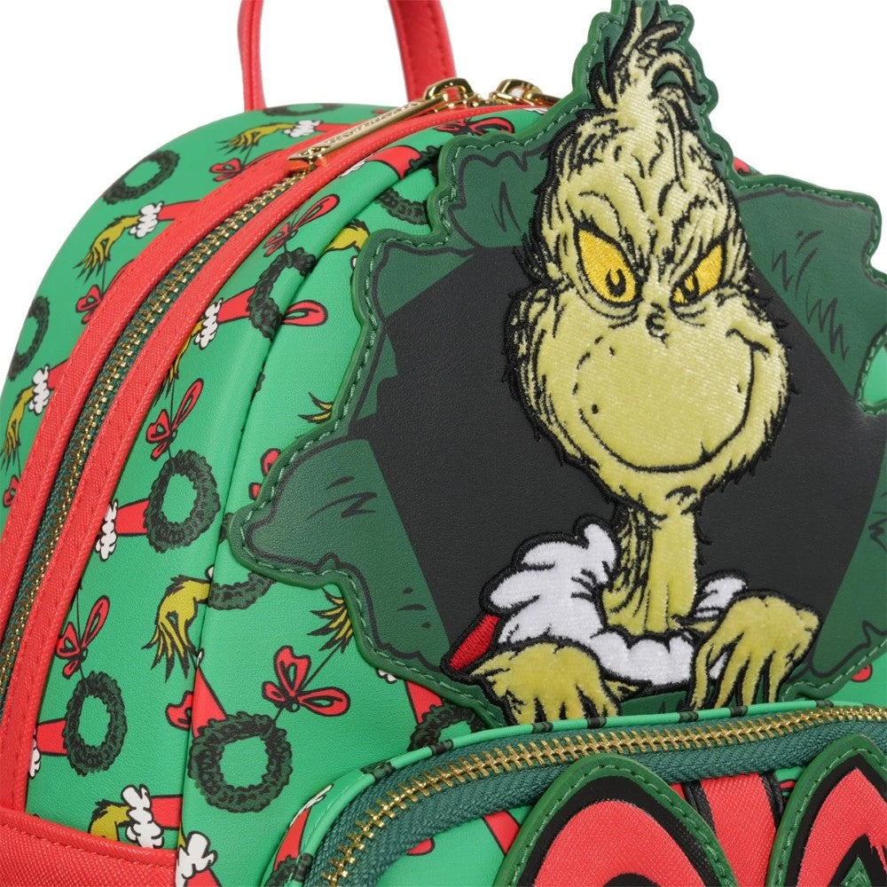Loungefly How the Grinch Stole Christmas mini-backpack with Grinch face and wreath pattern in green and red colors