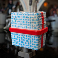 Hasbro Star Wars Gronk Blue Christmas Present Droid action figure decorated with blue snowflakes and red ribbon details