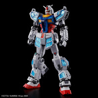 Standing Gundam model in white, red, and blue with detailed translucent blue panel accents on a black background