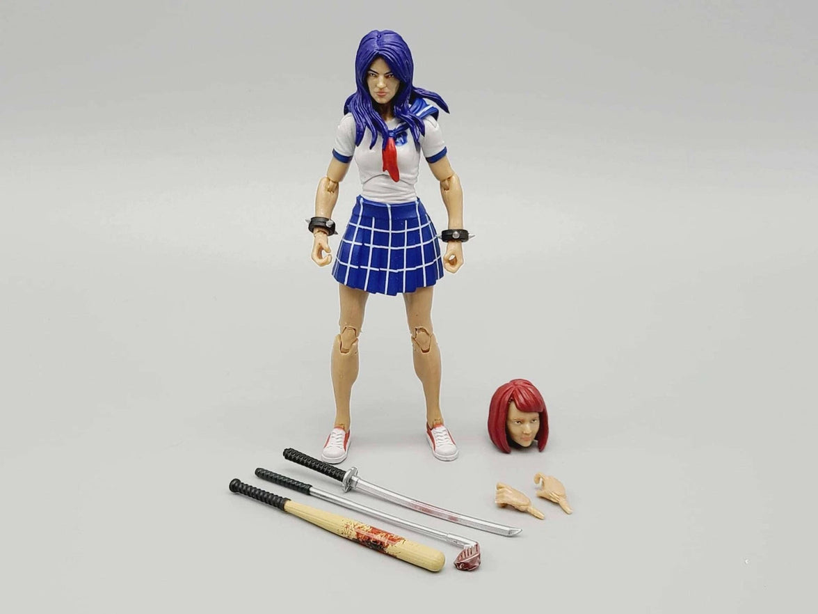 Action figure with blue hair and school uniform standing next to additional accessories on a gray background