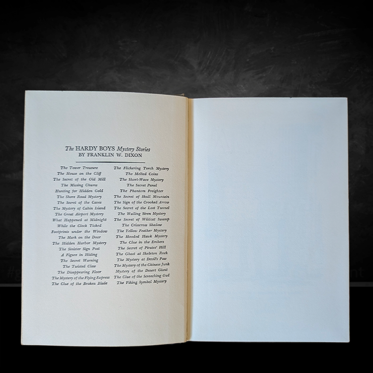 Vintage open Hardy Boys book showing list of mystery titles by Franklin W. Dixon from 1959 edition