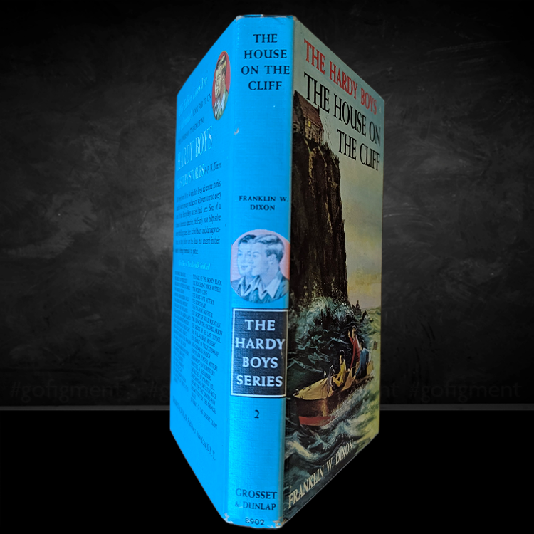 Vintage 1959 Hardy Boys book The House on the Cliff with iconic Rudi Nappi cover and blue spine by Grosset & Dunlap