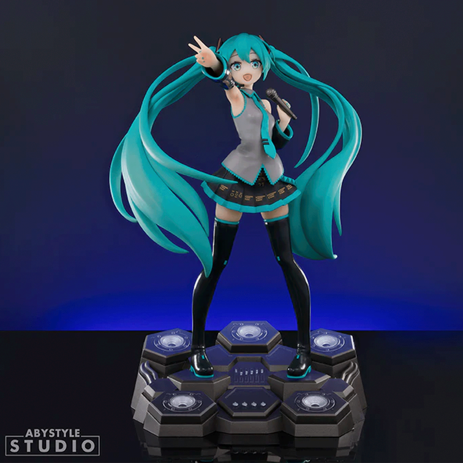 Abysse dynamic 1:10 scale Hatsune Miku statue with flowing teal hair and detailed black and teal outfit on hexagonal base