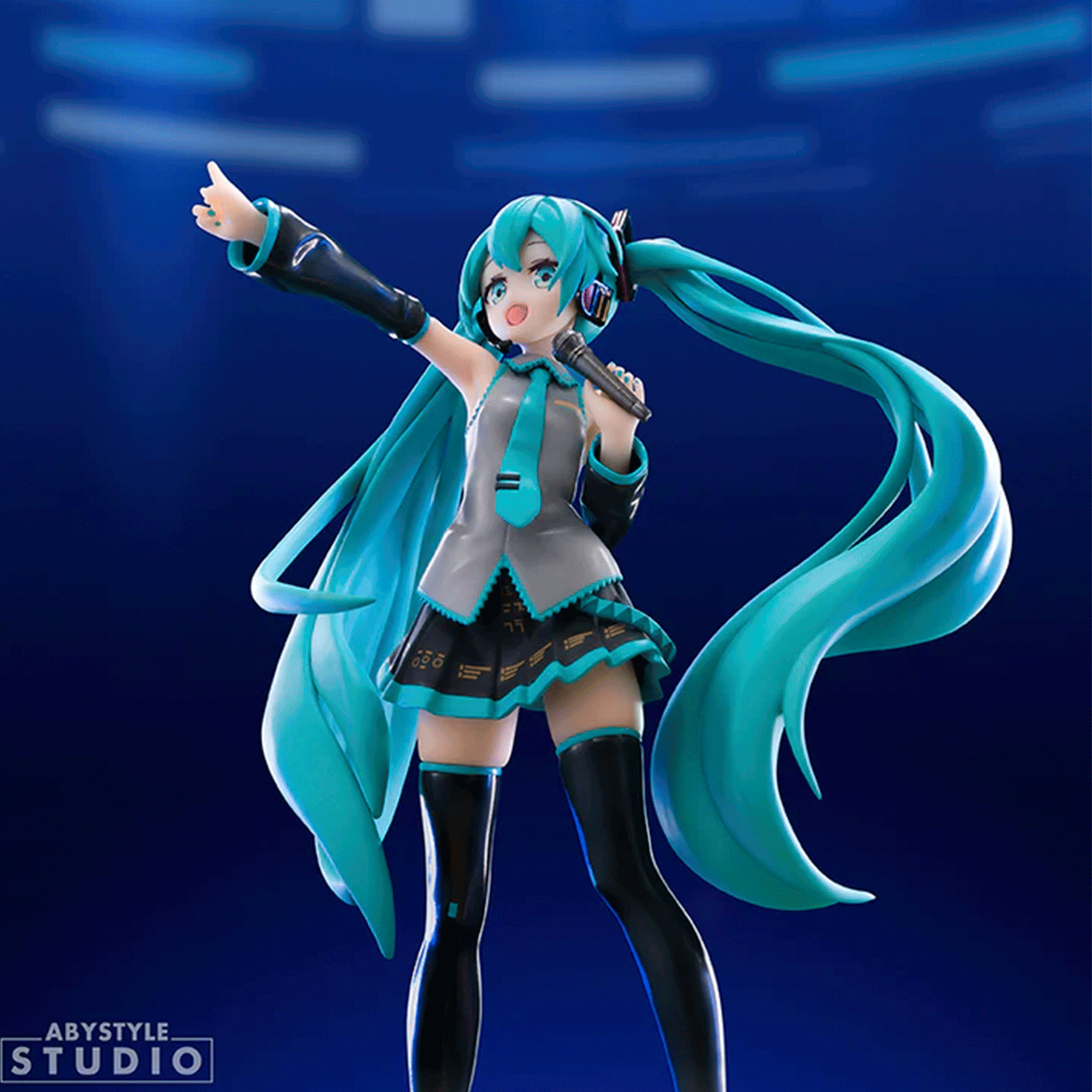 Dynamic Abysse 1:10 scale Hatsune Miku statue with flowing teal twin tails and microphone in energetic singing pose on blue background