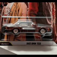 Mattel Hot Wheels 1983 BMW 733i Stranger Things Pop Culture 2026 die-cast car side view in package
