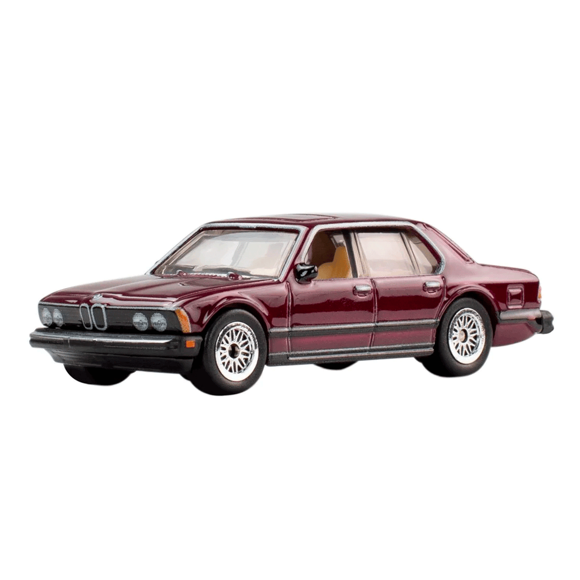 Mattel Hot Wheels 1983 BMW 733i die-cast model car in dark red with detailed wheels and interior side angle view