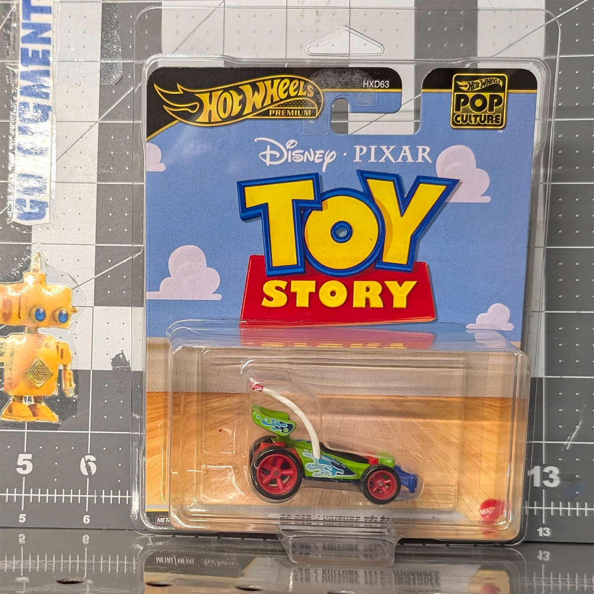 Toy Story RC Car 1:64 Scale Hot Wheels Premium Pop Culture Diecast Car by Mattel in colorful character-themed design and packaging