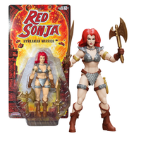 Red Sonja Hyrkanian Warrior action figure with axe beside its colorful retail packaging
