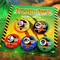 Doctor Collector Jurassic Park badge set featuring colorful Brachiosaurus, Dilophosaurus, Velociraptor, T-Rex, and Triceratops pins