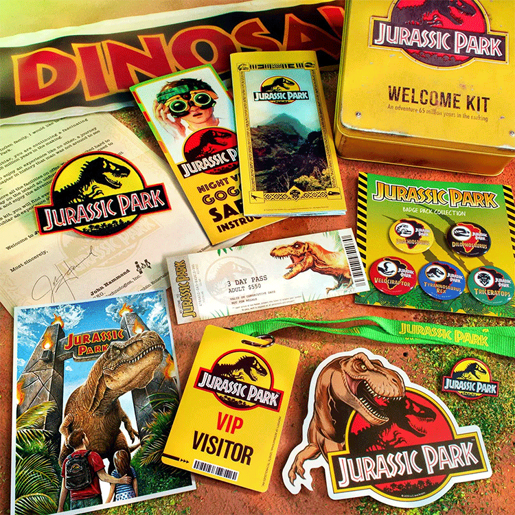 Doctor Collector Jurassic Park Ultimate Welcome Kit with collector cards, VIP pass, dinosaur stickers, and metal tin box