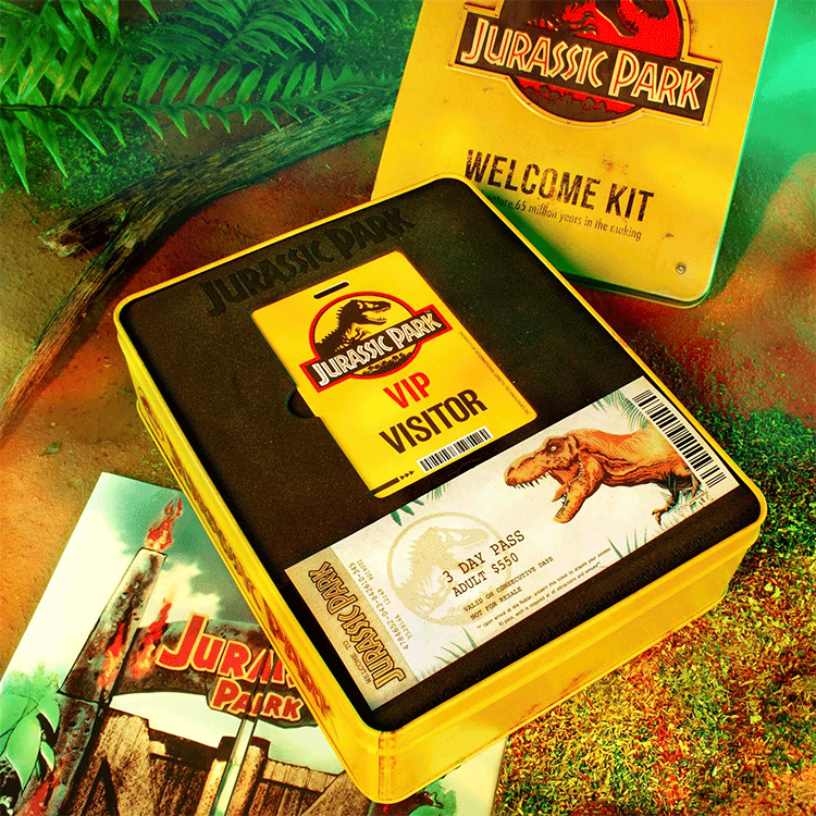Doctor Collector Jurassic Park Ultimate Welcome Kit tin with VIP pass, dinosaur ticket, and iconic themed collectibles inside