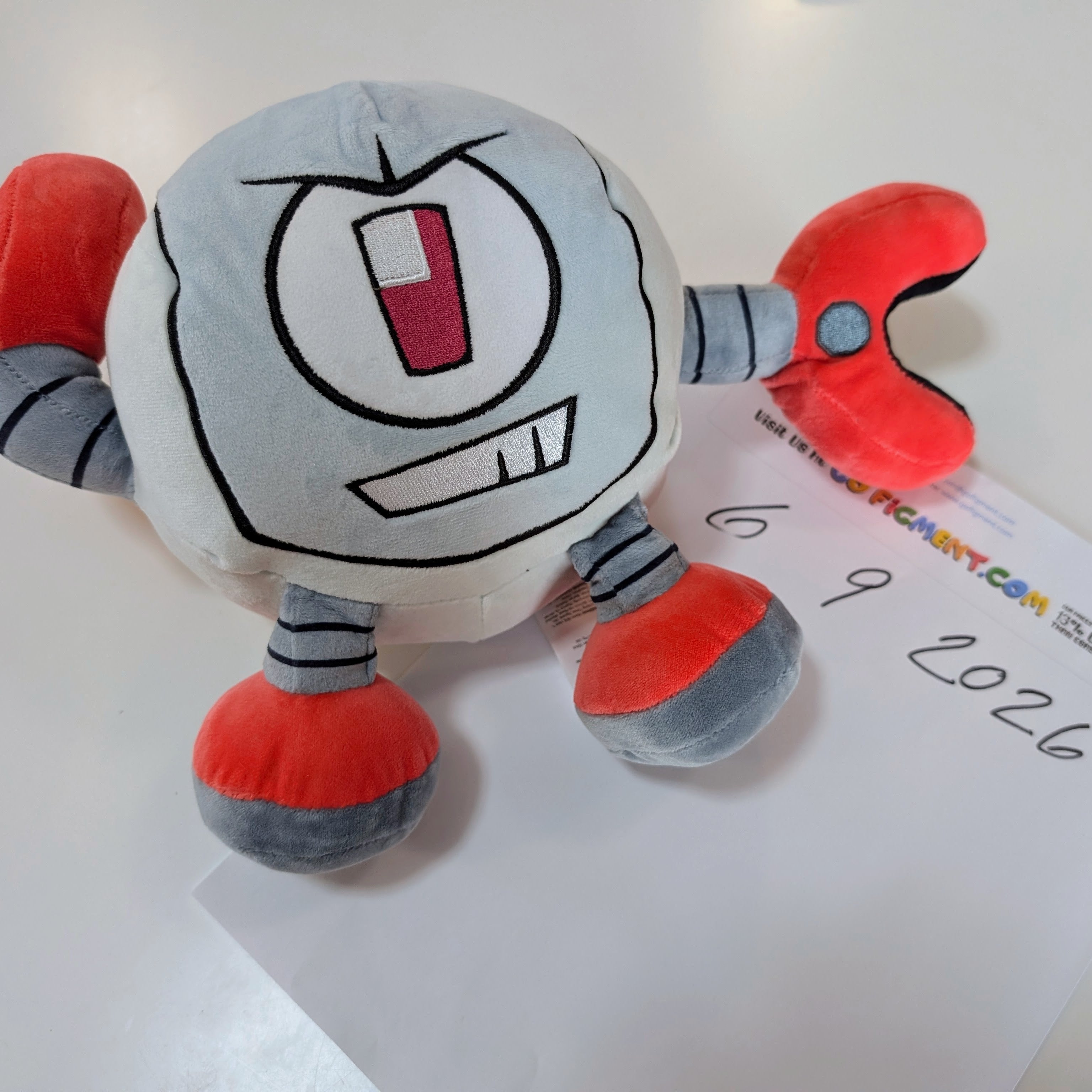 Kaboodle Plush Gameoverse Official Collectible Figure by Glitch Productions with gray body and red claw arms on white surface