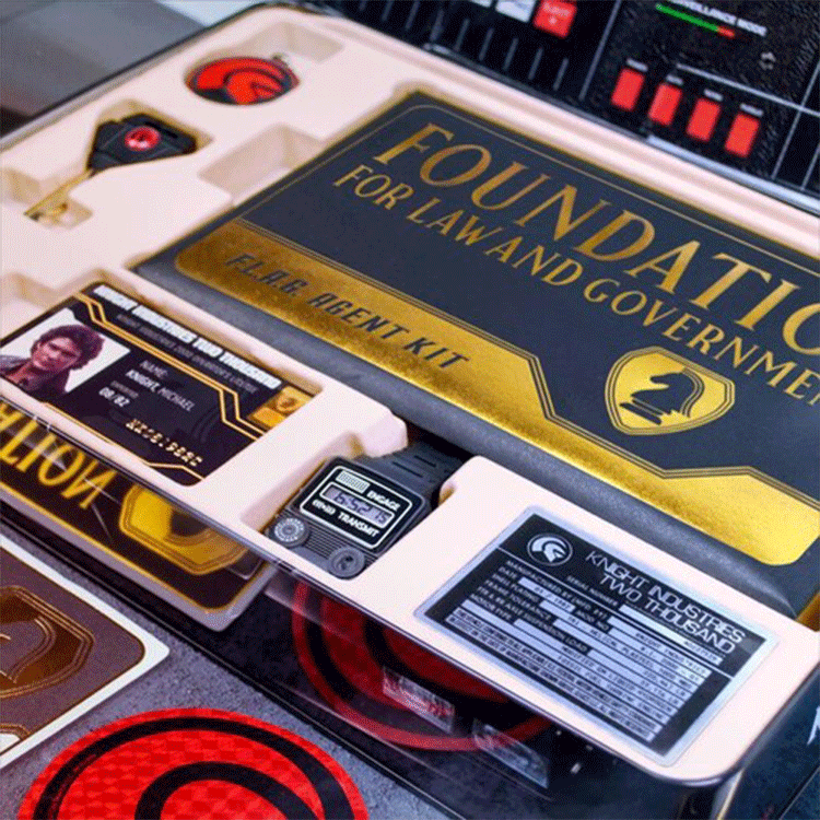 Close-up of Doctor Collector Knight Rider F.L.A.G. Agent Kit components including ID card and data devices in collector box tray