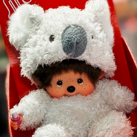 Sekiguchi Monchhichi sitting plush doll dressed in fluffy white koala costume with thumb in mouth